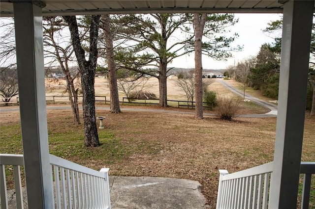 view of yard with a rural view