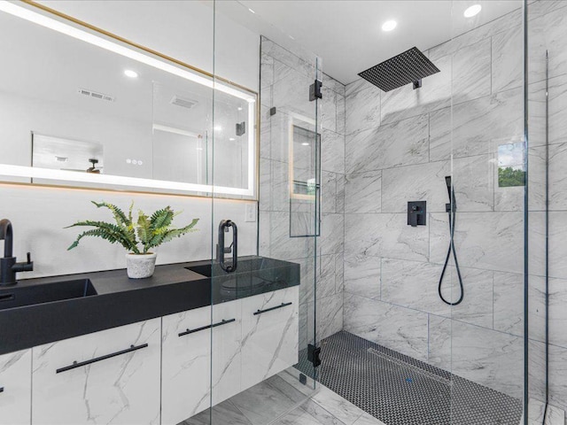 1603 Ezra Church Dr NW, Atlanta, GA 30314 - full bath with marble look tile flooring, a stall shower, a sink, and recessed lighting