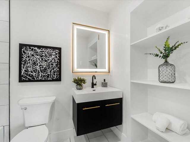 1603 Ezra Church Dr NW, Atlanta, GA 30314 - bathroom with toilet, vanity, and tile patterned floors