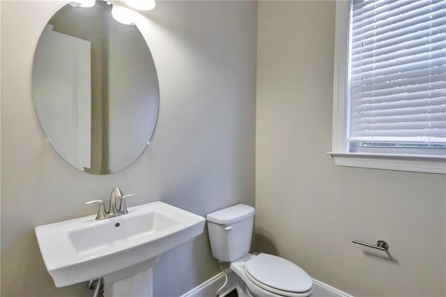 bathroom with toilet and sink