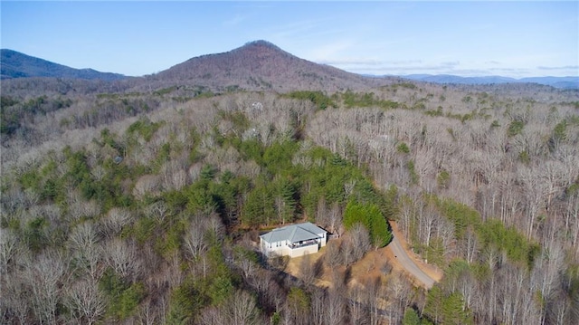 aerial view with a mountain view and a view of trees