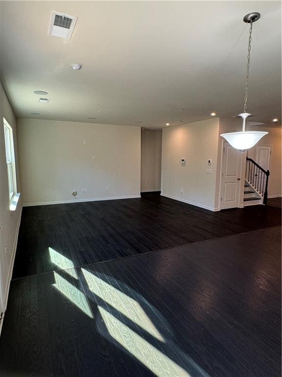 136 Paulownia Cir, Mcdonough, GA 30253 - empty room featuring wood finished floors, stairway, and recessed lighting