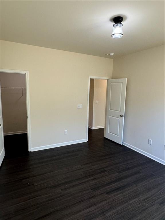 136 Paulownia Cir, Mcdonough, GA 30253 - spare room with dark wood finished floors and baseboards