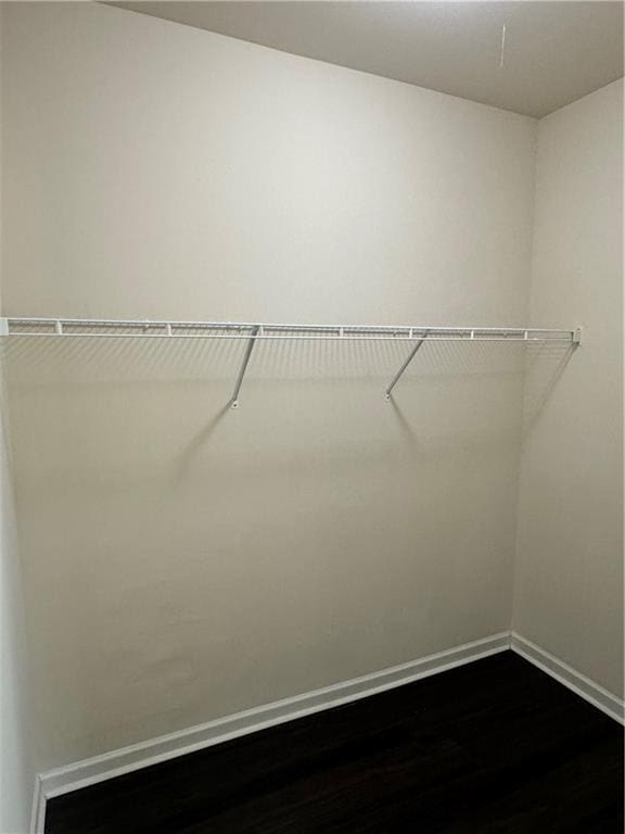 136 Paulownia Cir, Mcdonough, GA 30253 - spacious closet featuring dark wood-style floors