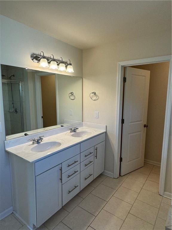 136 Paulownia Cir, Mcdonough, GA 30253 - bathroom featuring double vanity, tile patterned flooring, and a stall shower