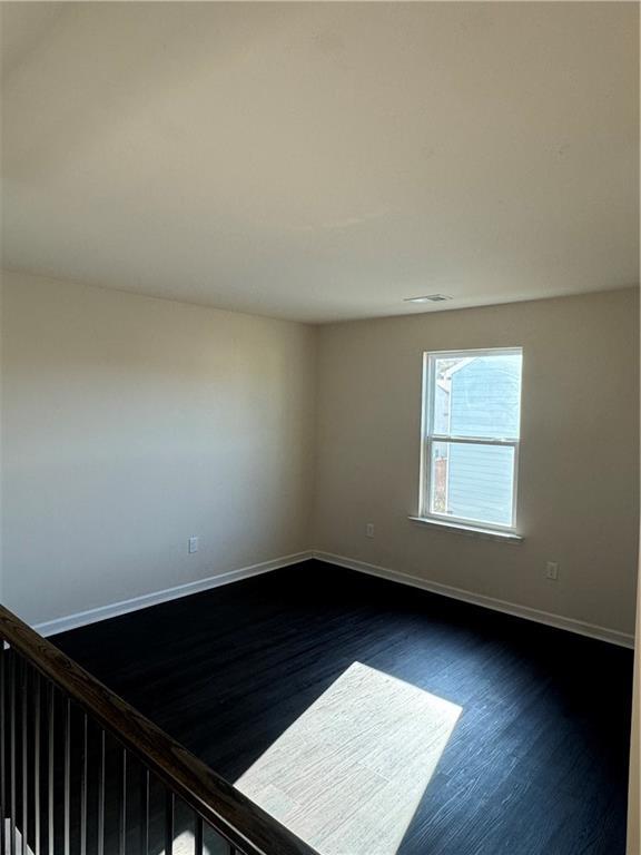 136 Paulownia Cir, Mcdonough, GA 30253 - empty room with dark wood-style floors