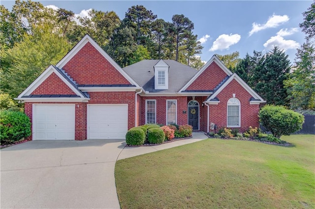 view of front of house with a front yard and a garage