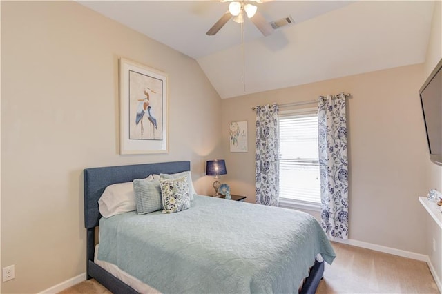 carpeted bedroom featuring ceiling fan and vaulted ceiling