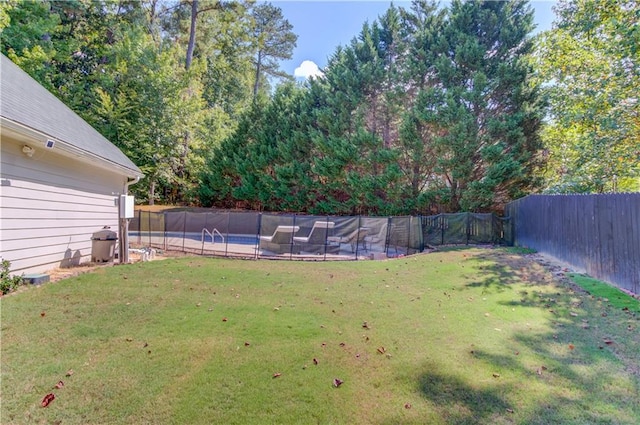 view of yard featuring a fenced in pool