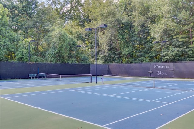 view of sport court featuring basketball hoop