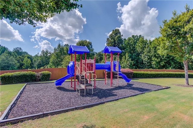 view of jungle gym with a lawn