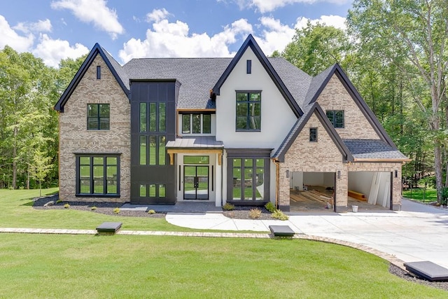 4459 Grady Smith Rd, Loganville, GA 30052 - view of front of home featuring a shingled roof, brick siding, a front yard, and french doors