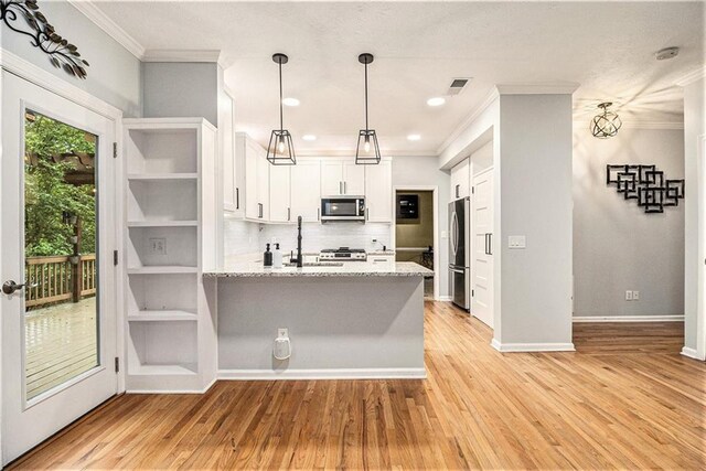 4272 Glenlake Dr NW, Kennesaw, GA 30144 - kitchen featuring stainless steel appliances, ornamental molding, a peninsula, white cabinets, and tasteful backsplash