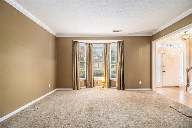 4272 Glenlake Dr NW, Kennesaw, GA 30144 - carpeted empty room with crown molding, baseboards, a textured ceiling, and a chandelier