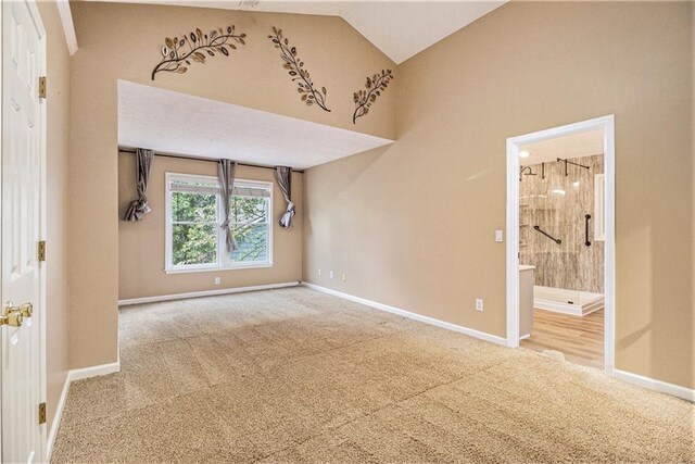 4272 Glenlake Dr NW, Kennesaw, GA 30144 - spare room with carpet, baseboards, and high vaulted ceiling