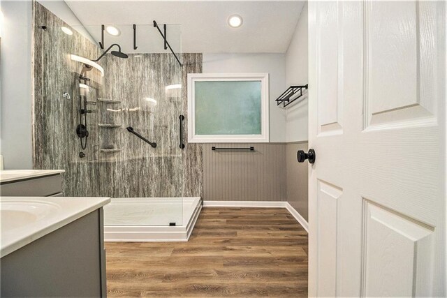 4272 Glenlake Dr NW, Kennesaw, GA 30144 - bathroom with vanity, a walk in shower, wainscoting, wood finished floors, and recessed lighting