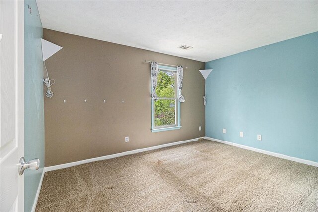 4272 Glenlake Dr NW, Kennesaw, GA 30144 - spare room with baseboards, carpet floors, and a textured ceiling