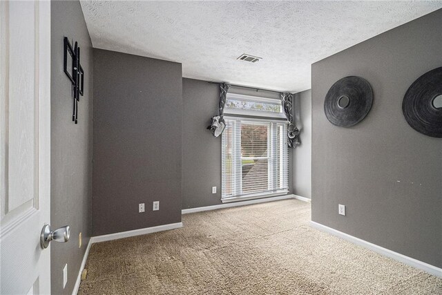 4272 Glenlake Dr NW, Kennesaw, GA 30144 - spare room with carpet, baseboards, and a textured ceiling