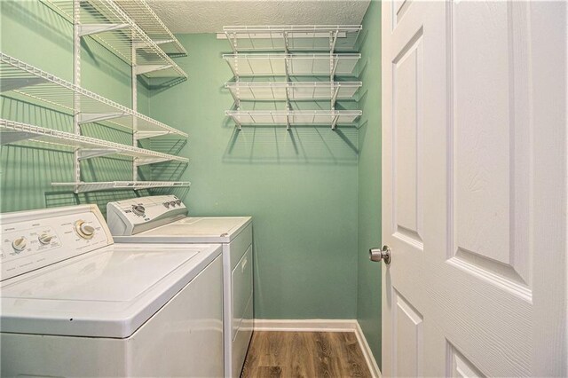 4272 Glenlake Dr NW, Kennesaw, GA 30144 - laundry room with independent washer and dryer, wood finished floors, and baseboards