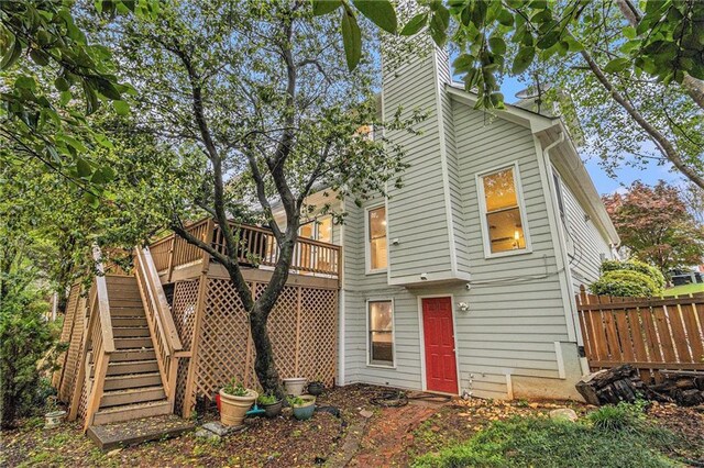 4272 Glenlake Dr NW, Kennesaw, GA 30144 - rear view of property with a wooden deck, a chimney, and stairway