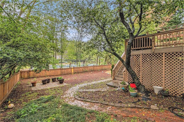 4272 Glenlake Dr NW, Kennesaw, GA 30144 - fenced backyard featuring stairway and a deck