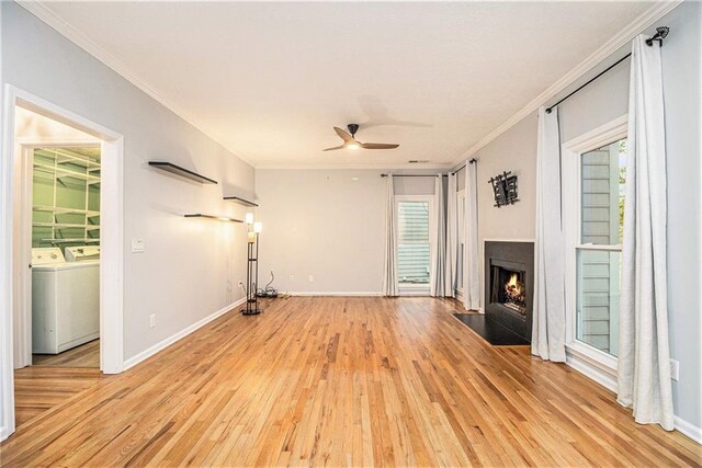 4272 Glenlake Dr NW, Kennesaw, GA 30144 - unfurnished living room featuring light wood-type flooring, separate washer and dryer, ceiling fan, plenty of natural light, and ornamental molding