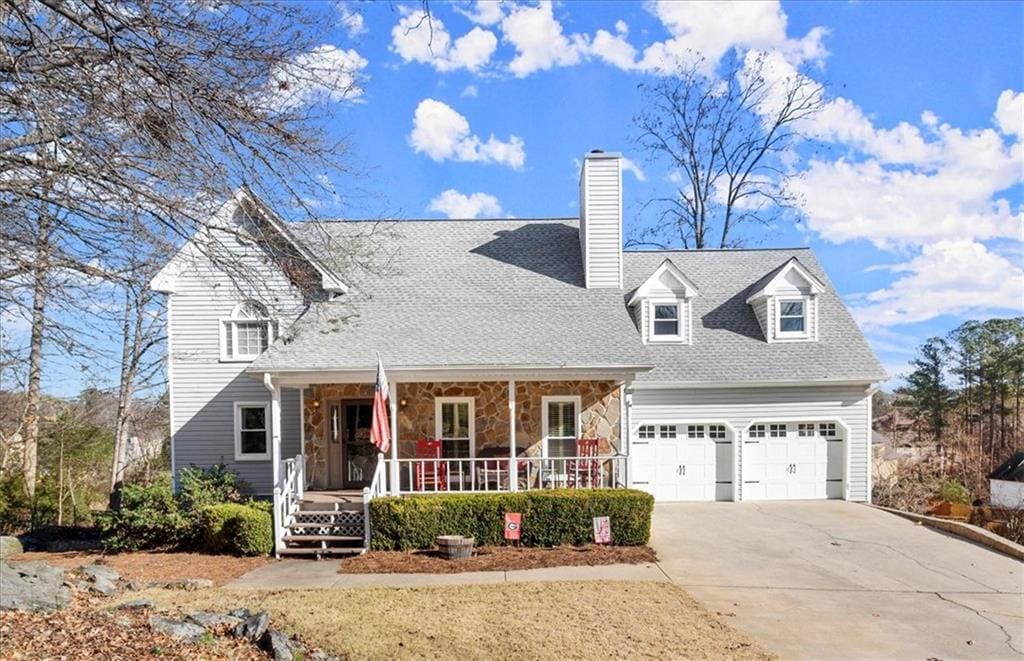 view of front of house with covered porch and a garage