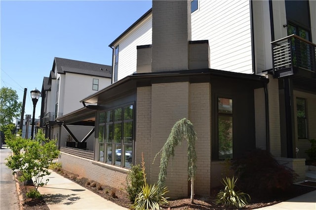 1350 May Ave Unit 14, Atlanta, GA 30316 - view of property exterior featuring brick siding and a chimney