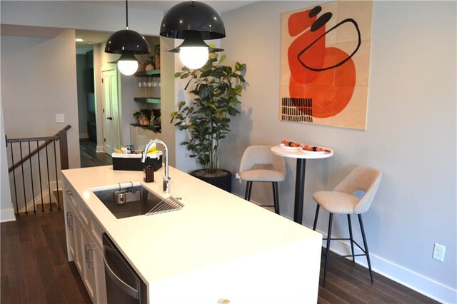 1350 May Ave Unit 14, Atlanta, GA 30316 - kitchen featuring stainless steel dishwasher, baseboards, dark wood-style floors, and a sink