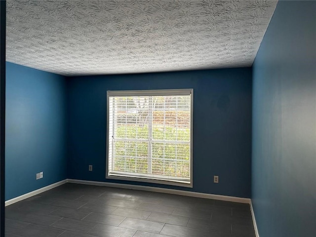 1101 Lenox Way NE Unit 1101, Atlanta, GA 30324 - unfurnished room featuring tile patterned flooring, a textured ceiling, and baseboards