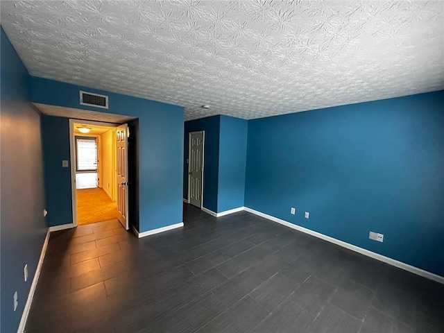 1101 Lenox Way NE Unit 1101, Atlanta, GA 30324 - spare room featuring baseboards and a textured ceiling