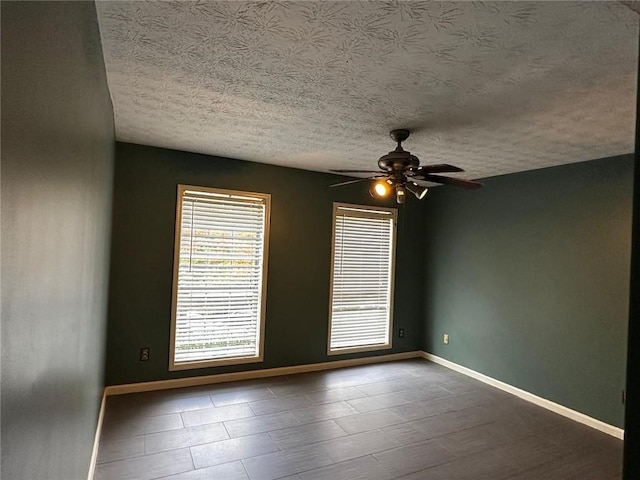 1101 Lenox Way NE Unit 1101, Atlanta, GA 30324 - empty room with ceiling fan, a textured ceiling, and baseboards