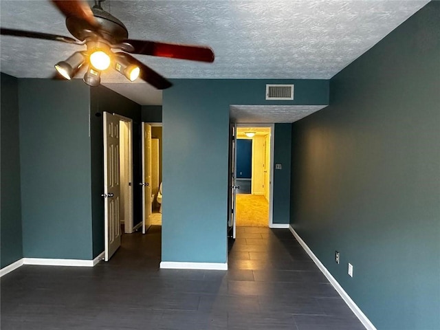 1101 Lenox Way NE Unit 1101, Atlanta, GA 30324 - unfurnished bedroom featuring baseboards, a textured ceiling, and ceiling fan