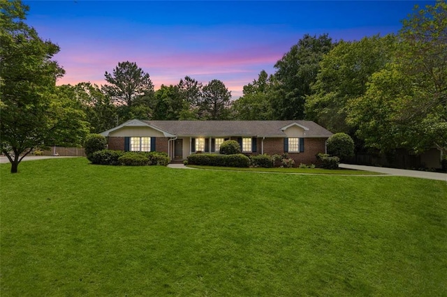 ranch-style home featuring brick siding