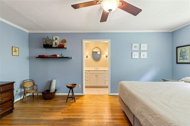 bedroom with light wood-style flooring, ornamental molding, a sink, connected bathroom, and ceiling fan