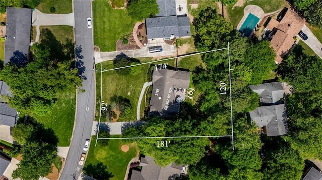 aerial view of residential area featuring property boundaries highlighted