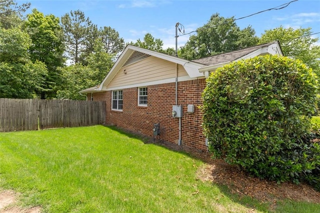 view of side of home featuring brick siding