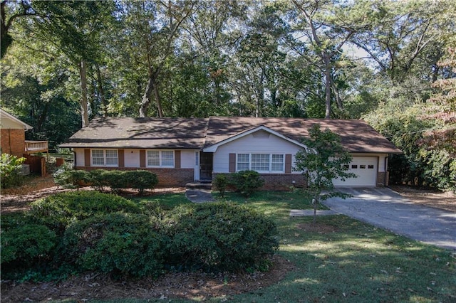 ranch-style house with a front yard and a garage