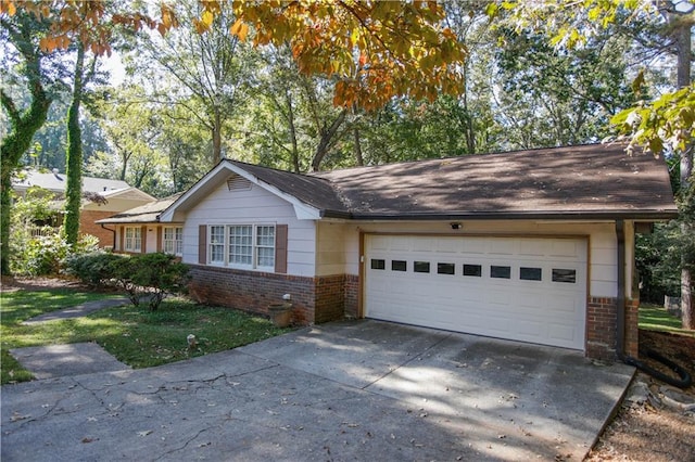 ranch-style house featuring a garage