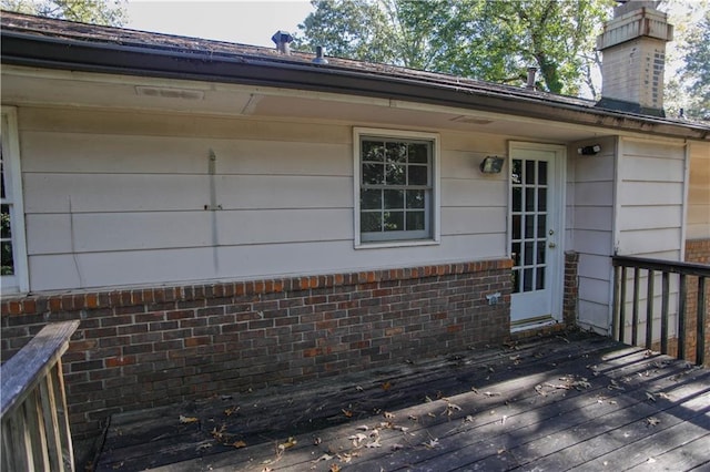 property entrance with a deck