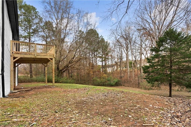 view of yard with a wooden deck