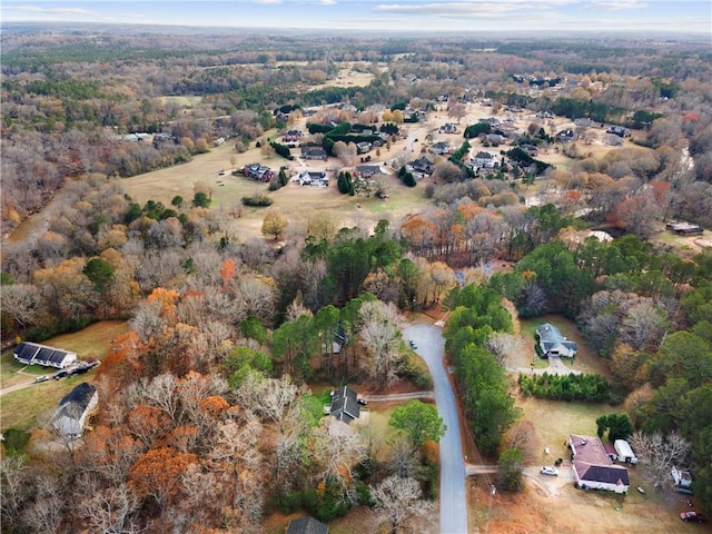 drone / aerial view featuring a view of trees