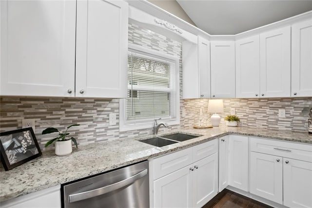1684 Braeburn Dr SE, Atlanta, GA 30316 - kitchen with dishwasher, a sink, vaulted ceiling, white cabinets, and tasteful backsplash