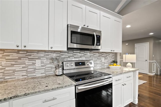 1684 Braeburn Dr SE, Atlanta, GA 30316 - kitchen featuring stainless steel appliances, dark wood finished floors, tasteful backsplash, white cabinets, and recessed lighting