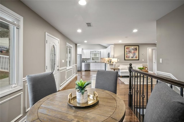1684 Braeburn Dr SE, Atlanta, GA 30316 - dining room with a wainscoted wall, a decorative wall, recessed lighting, and dark wood-type flooring