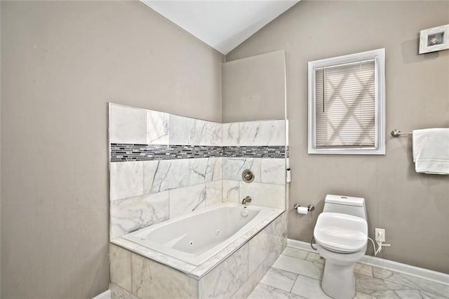 1684 Braeburn Dr SE, Atlanta, GA 30316 - bathroom featuring marble finish flooring, toilet, vaulted ceiling, a tub with jets, and baseboards