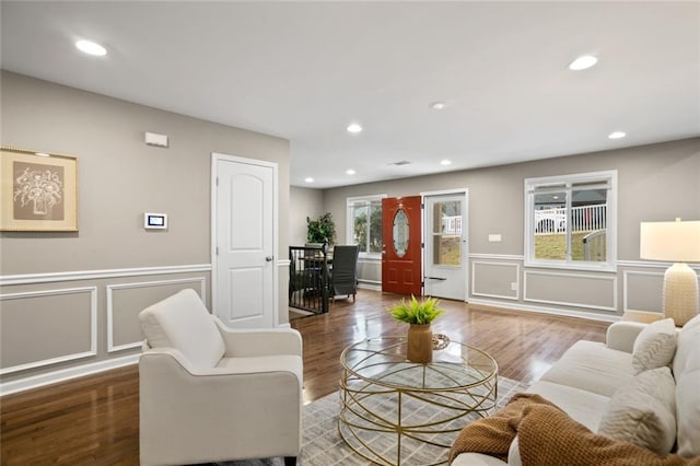 1684 Braeburn Dr SE, Atlanta, GA 30316 - living room featuring a decorative wall, a wainscoted wall, wood finished floors, and recessed lighting