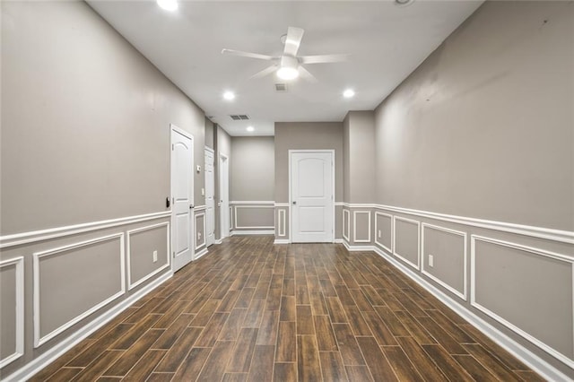 1684 Braeburn Dr SE, Atlanta, GA 30316 - empty room featuring ceiling fan, wood finished floors, a decorative wall, recessed lighting, and wainscoting