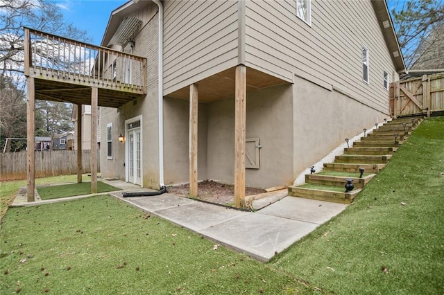 1684 Braeburn Dr SE, Atlanta, GA 30316 - back of house with stucco siding, a wooden deck, french doors, and a patio