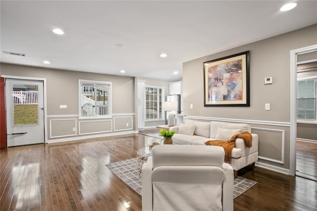 1684 Braeburn Dr SE, Atlanta, GA 30316 - living room with healthy amount of natural light, hardwood / wood-style floors, wainscoting, recessed lighting, and a decorative wall